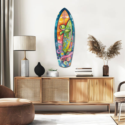 Colorful surfboard-shaped glass wall art with vibrant chameleon design displayed above wooden mid-century modern credenza in contemporary living room.