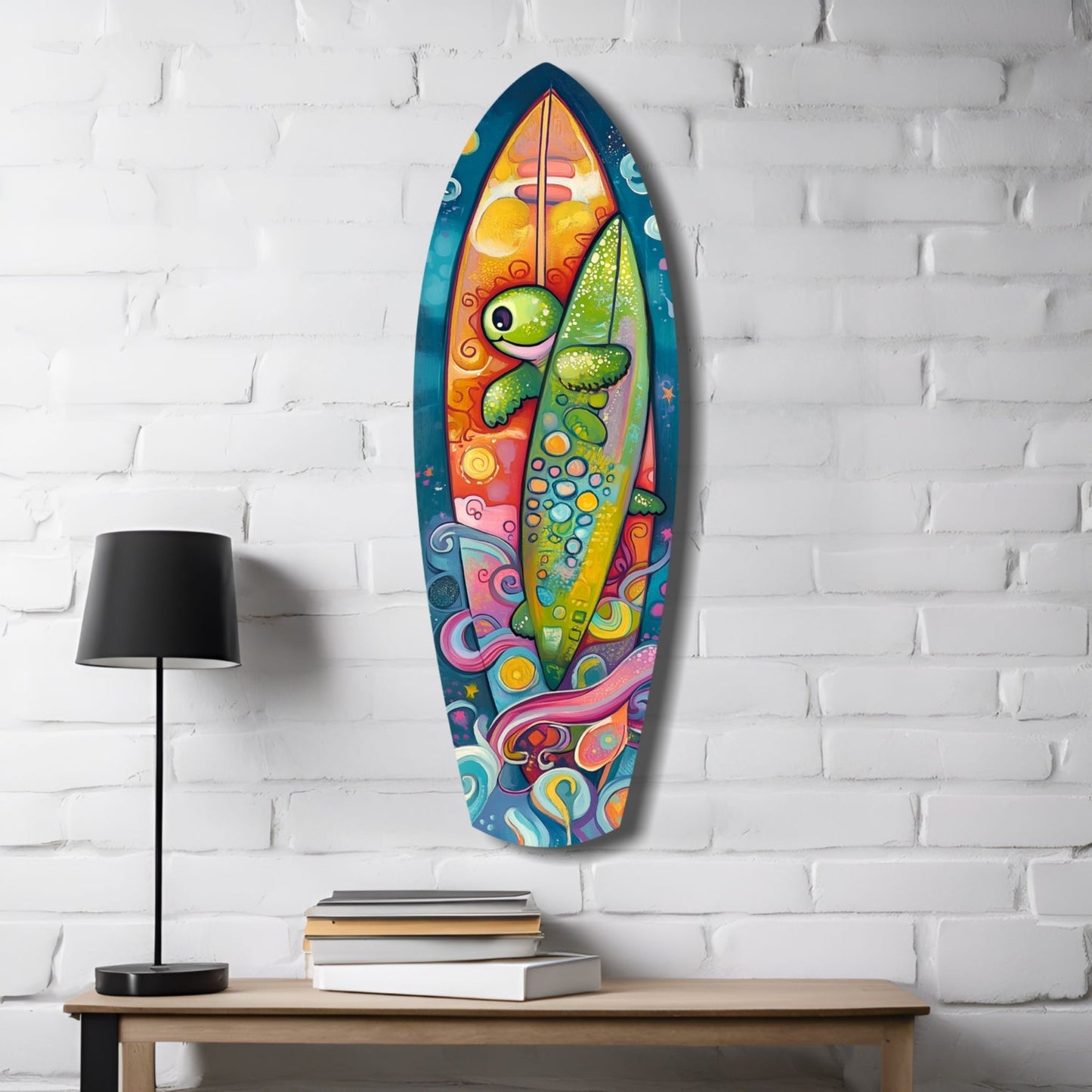 Colorful glass surfboard wall art depicting a stylized fish with yellow eye and green scales, displayed on white brick above wooden table with lamp and books.