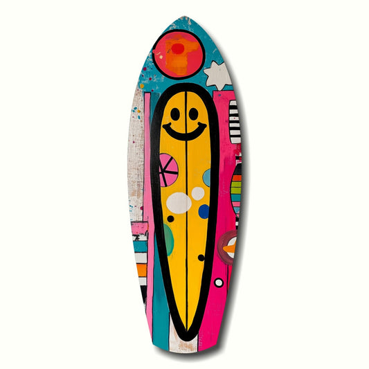 Colorful surfboard-shaped wall art featuring a yellow smiley face with black outline, surrounded by pink, teal, and multicolored geometric patterns on wooden board.