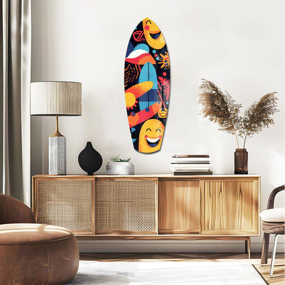 Colorful surfboard-shaped glass wall art with smiling faces and tropical fish displayed above wooden mid-century furniture in modern living room.