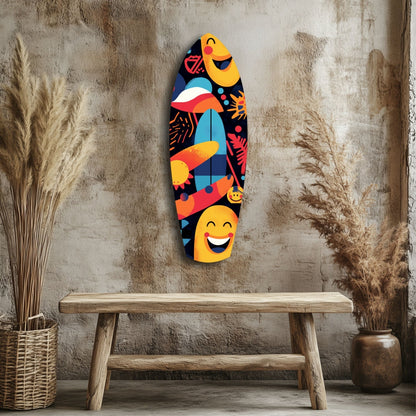 Colorful surfboard-shaped glass wall art with smiling faces and abstract patterns displayed on textured wall above wooden bench with dried grasses.