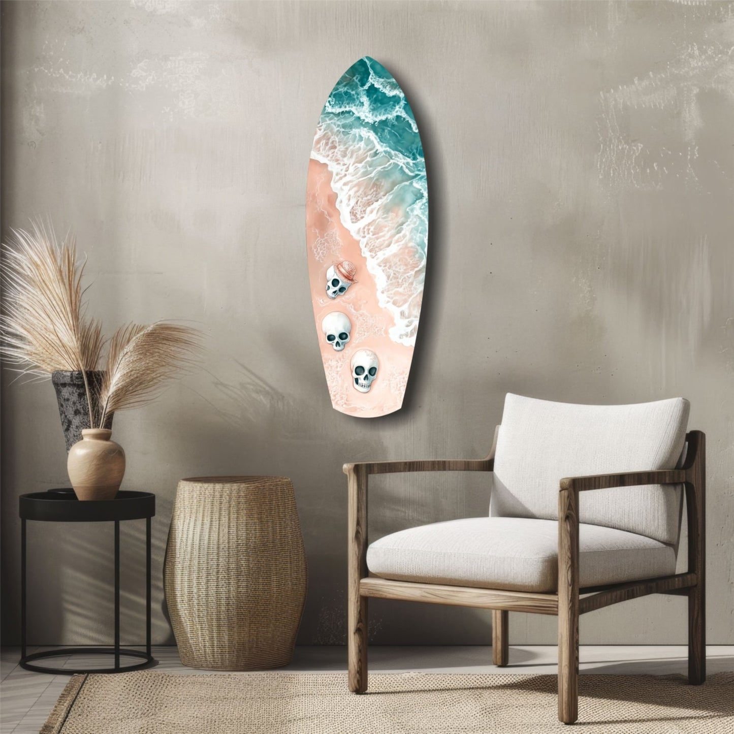 Surfboard-shaped wall art featuring ocean waves, sandy beach, and three skull designs mounted above a wooden chair in a coastal-styled room.