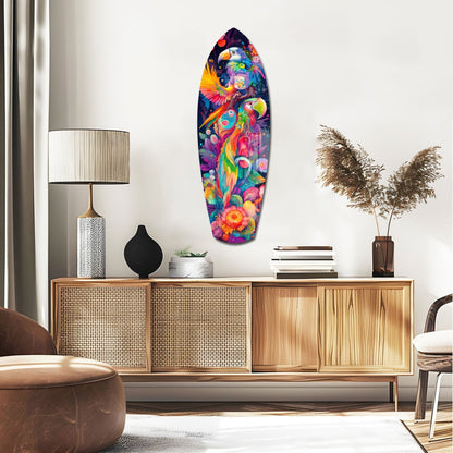 Colorful surfboard-shaped glass wall art with vibrant tropical birds and flowers mounted above a wooden credenza in a modern living room.