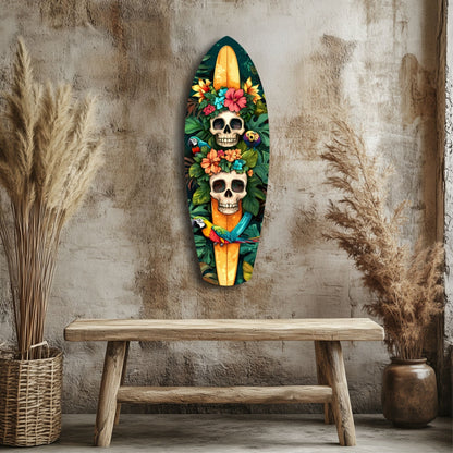 Tropical Mystique V2 glass wall art displaying two colorful skulls with flowers and a yellow surfboard mounted above wooden bench.