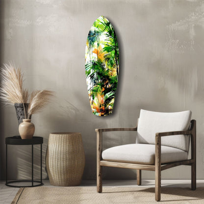 Tropical Forest Glass Wall Art displaying vibrant green palm leaves and golden yellow tones mounted on a neutral beige wall above wooden furniture.