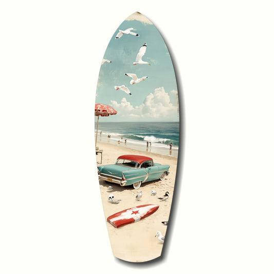 Surfboard-shaped glass art depicting a vintage turquoise car on a beach with seagulls and umbrella against a blue sky.