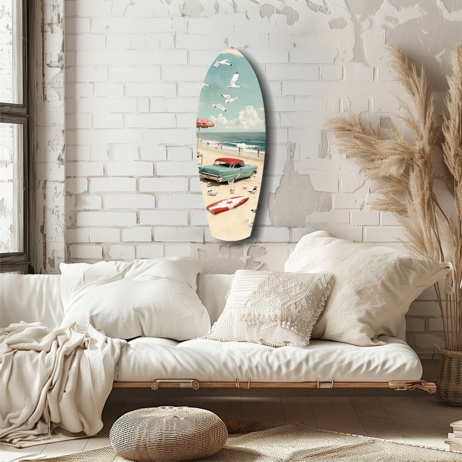 Surfboard-shaped glass art displaying vintage beach scene with turquoise car, sailboats, and red umbrella, hung on white brick wall above cream bedding.
