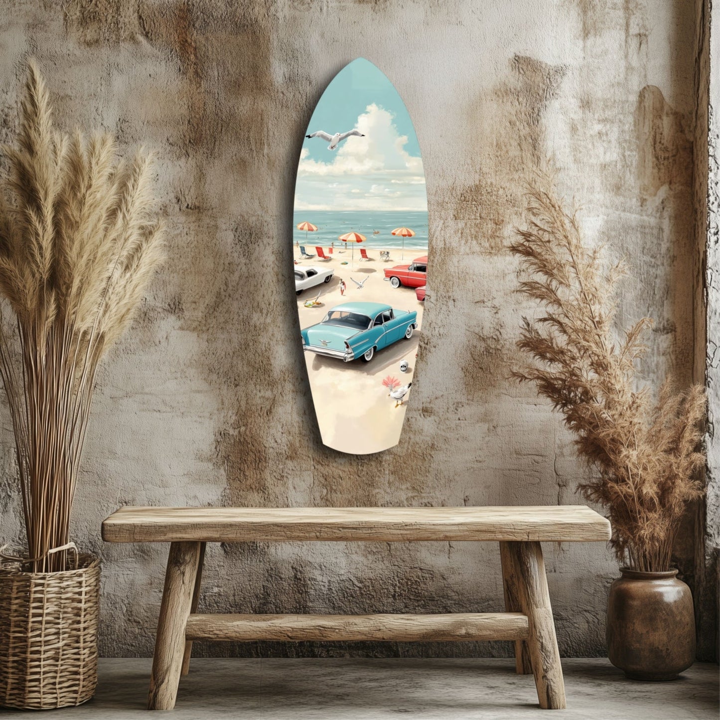 Surfboard-shaped glass wall art depicting a vintage blue car and beach scene, displayed above a wooden bench against a textured gray wall.