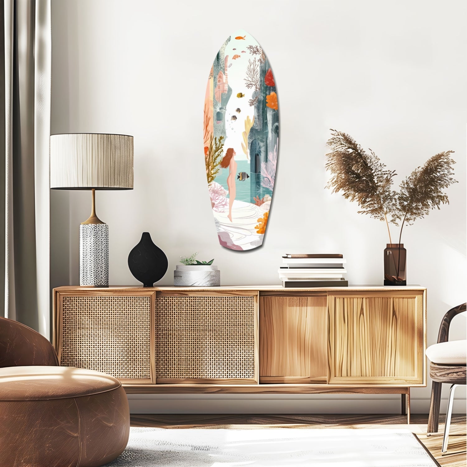 Oval glass wall art featuring an underwater seascape with swimming figure, coral, fish, and aquatic plants in soft pastels, displayed above a wooden dresser in a modern living room.