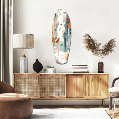Oval glass wall art featuring an underwater seascape with swimming figure, coral, fish, and aquatic plants in soft pastels, displayed above a wooden dresser in a modern living room.
