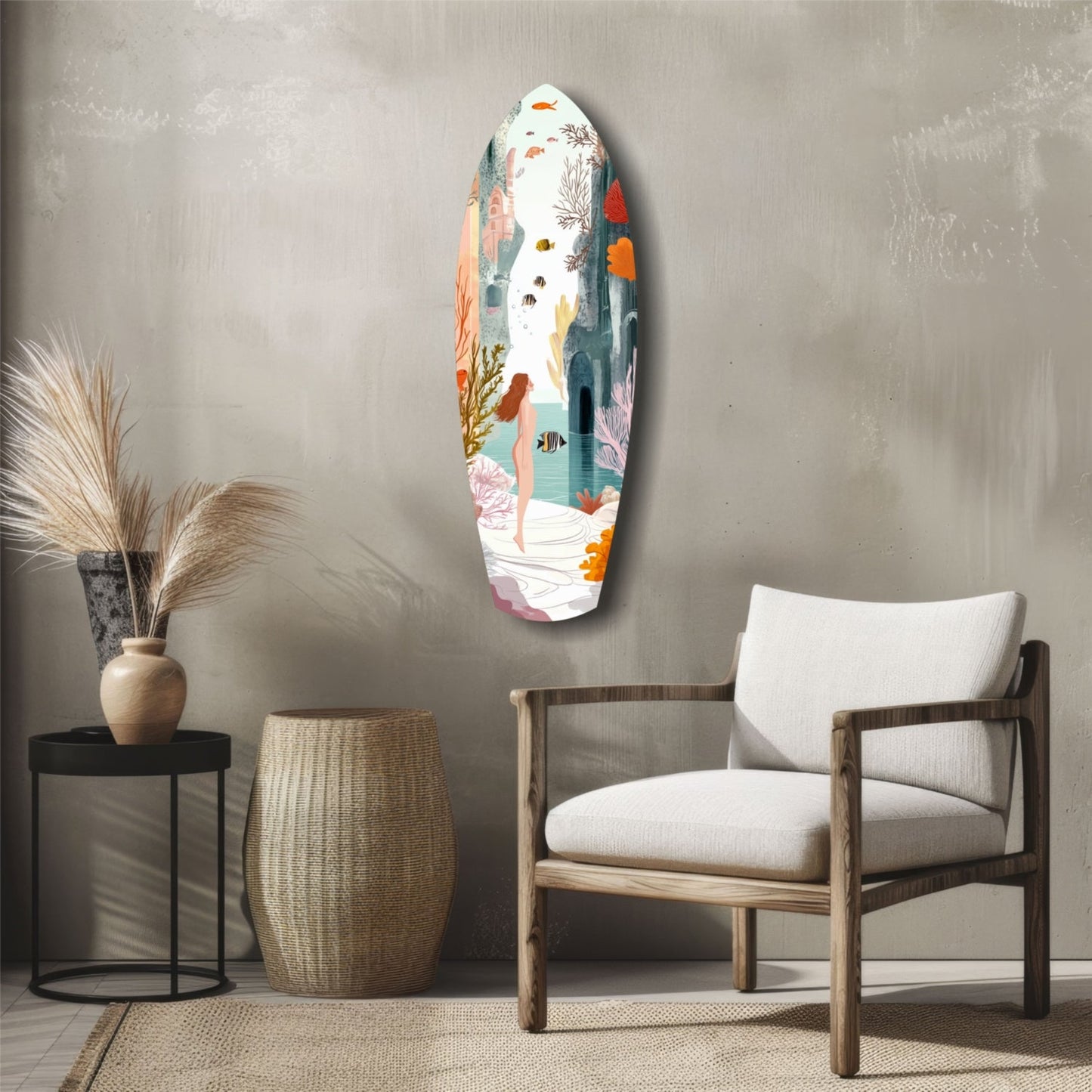 Oval glass wall art depicting an underwater seascape with a swimmer, coral, and fish in orange, teal, and pink tones, displayed above a wooden chair in a minimalist room setting.