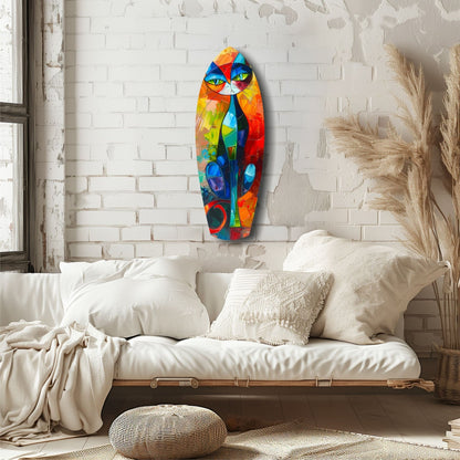 Colorful cubic cat glass wall art hanging above a white bedding setup in a minimalist bedroom with brick walls.