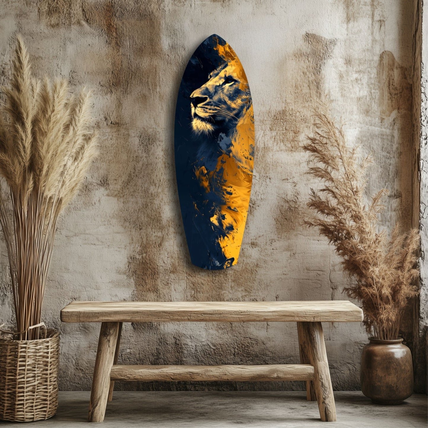 Blue and gold glass wall art depicting a lion's head, displayed above a wooden bench against a textured beige wall with dried grasses.