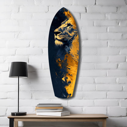 Oval glass wall art with gold and navy lion profile mounted above wooden table with lamp and stacked books.