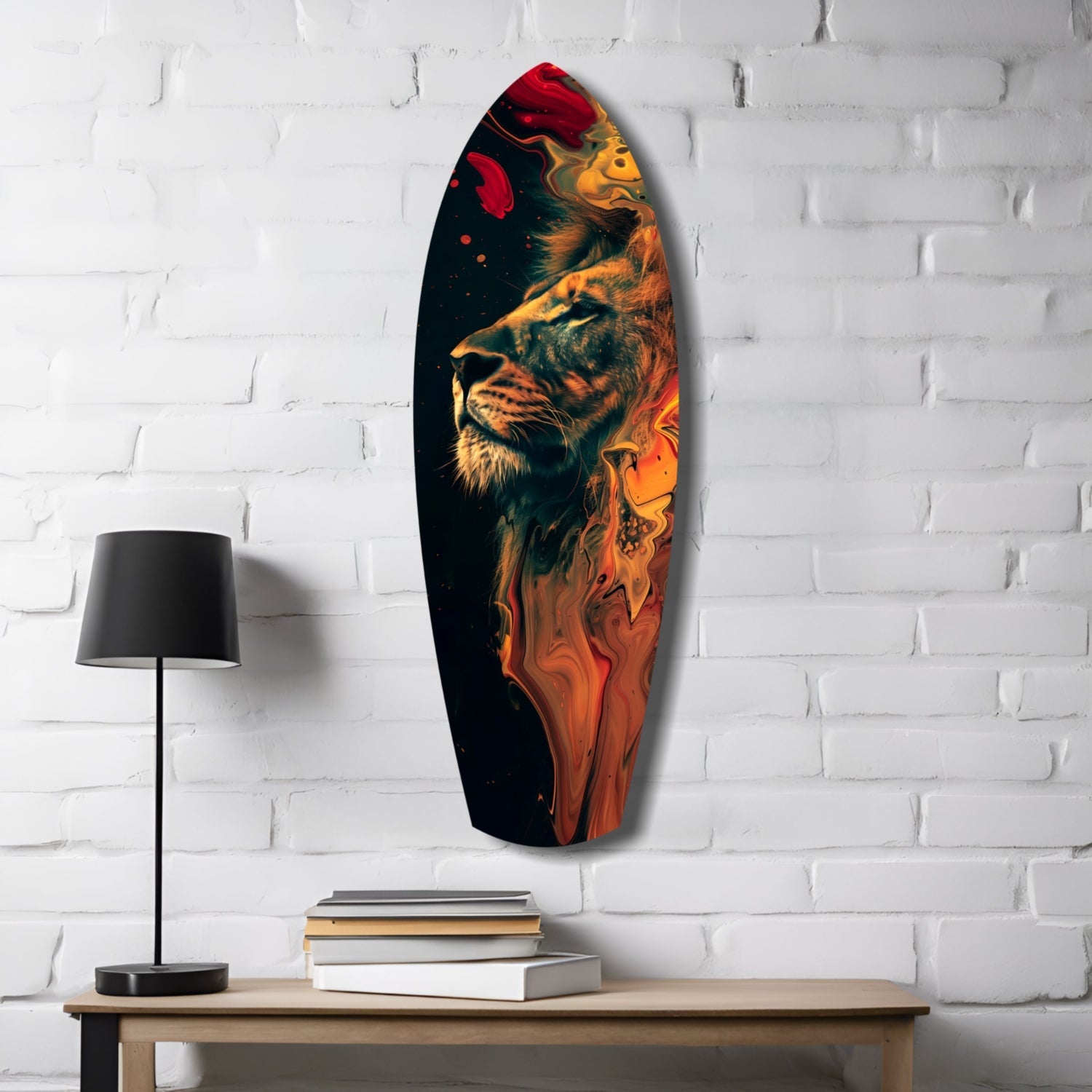 Oval glass wall art featuring a lion's head in gold and orange tones against black background, displayed on white brick wall above wooden desk with lamp and books.
