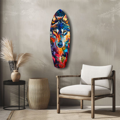 Colorful abstract wolf head glass art displayed vertically on neutral wall above wooden chair and side table.