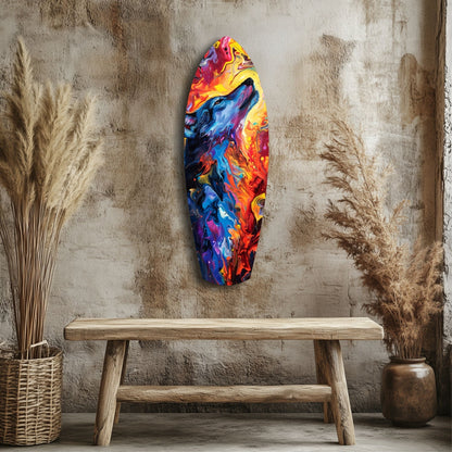 Colorful abstract glass wall art with blue, red, yellow, and purple swirled patterns displayed above wooden bench in rustic interior setting.