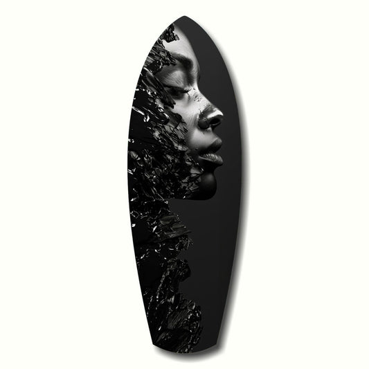 Black and white profile portrait of a person's face merged with splashing paint texture on an elongated black surfboard-shaped glass panel.