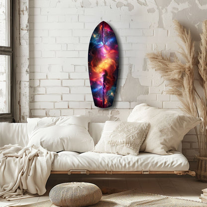 Vibrant cosmic glass wall art with purple, red, and blue nebula patterns displayed above a cream-colored bed in a minimalist bedroom.