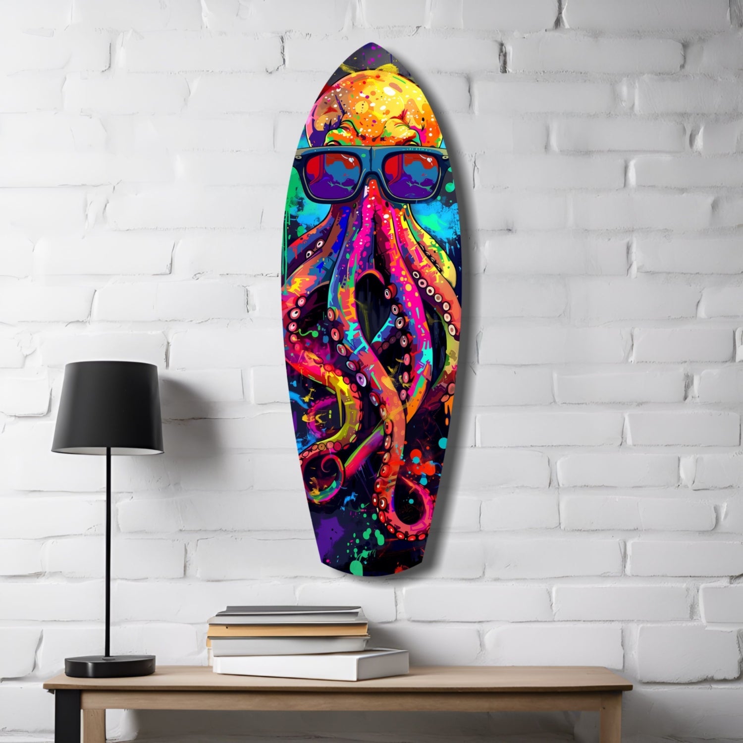 Colorful glass wall art of a cool octopus wearing sunglasses, displayed on white brick with lamp and books below.