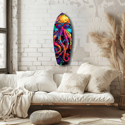 Colorful Mr Octopus glass wall art with vibrant rainbow tentacles and sunglasses displayed above a cream bedside seating area.