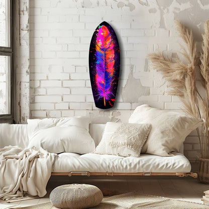 Vibrant neon feather glass wall art with pink, orange, blue, and purple colors displayed above a cream bedside in a minimalist bedroom.