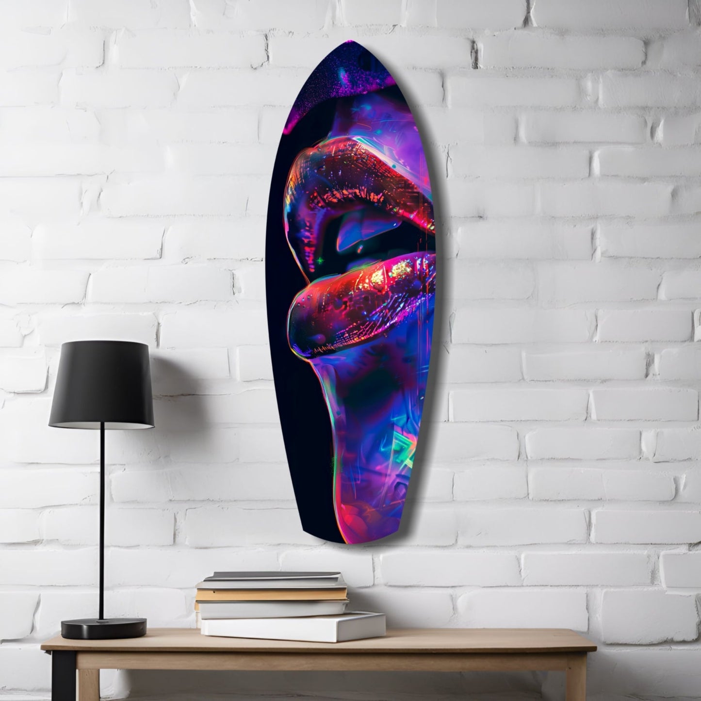 Neon-colored lips glass wall art in vibrant blues, pinks, and reds displayed on white brick wall above wooden desk with lamp and books.