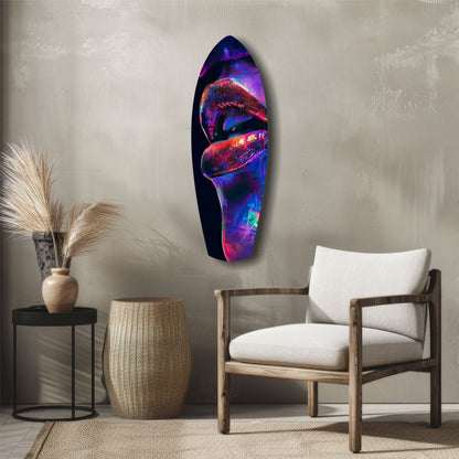 Vibrant neon lips glass art in purple, red, and blue tones displayed on neutral wall above wooden chair.