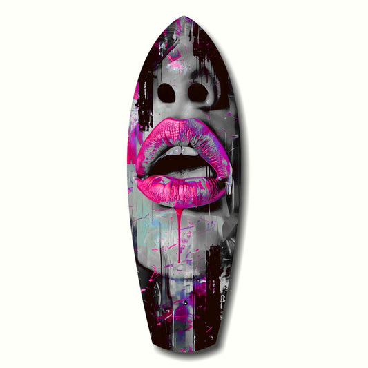 Surfboard-shaped glass art featuring a stylized face with large dark eyes and vibrant hot pink lips against a grayscale photographic background with purple and magenta accents.