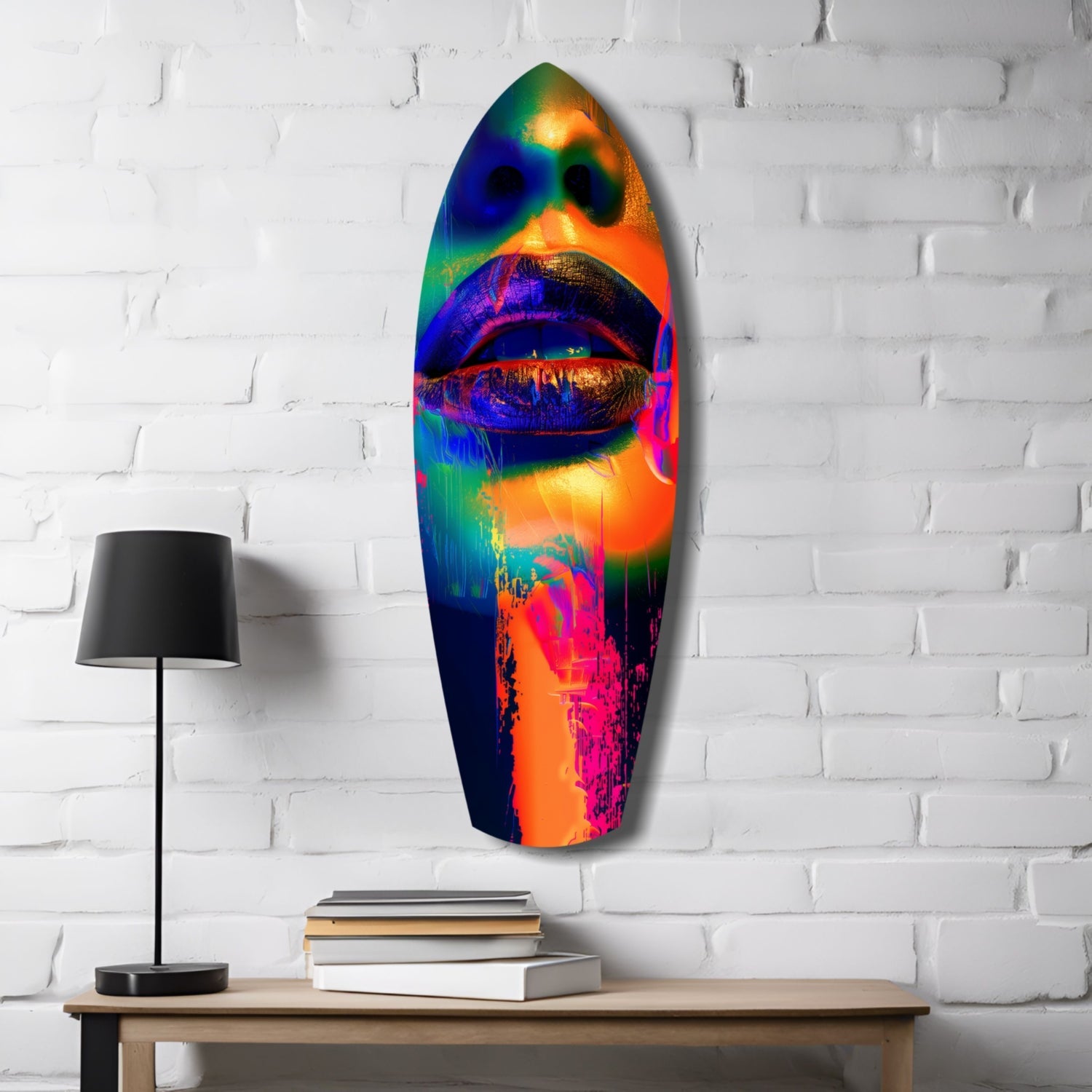 Colorful Lips V6 glass wall art in vibrant rainbow hues displayed on white brick wall above wooden table with lamp and books.