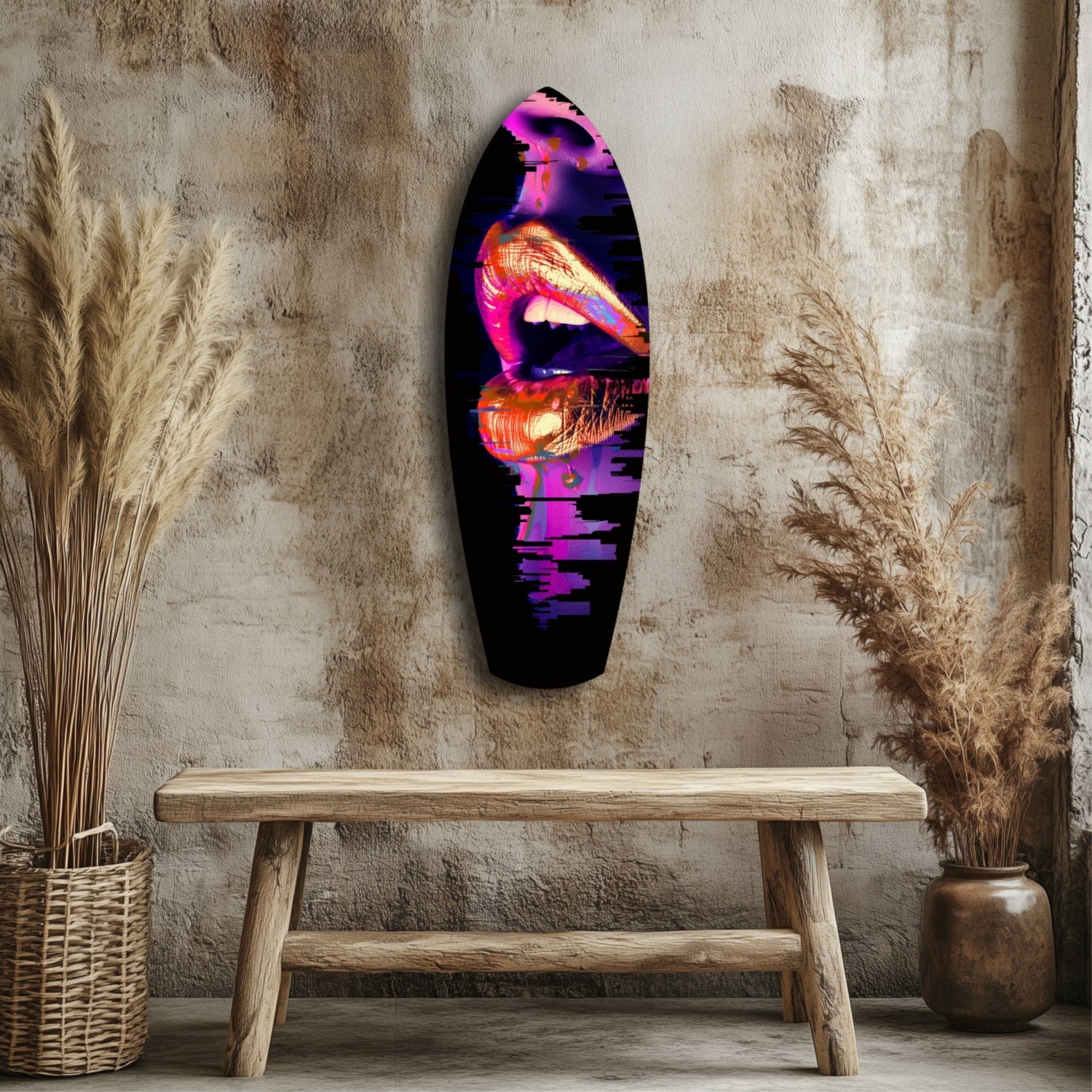 Neon pink and orange lips glass wall art displayed above wooden bench in rustic interior with dried pampas grass.