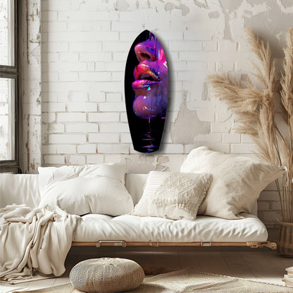 Oval glass wall art with neon pink and purple lips displayed above a cream sofa in a minimalist bedroom.