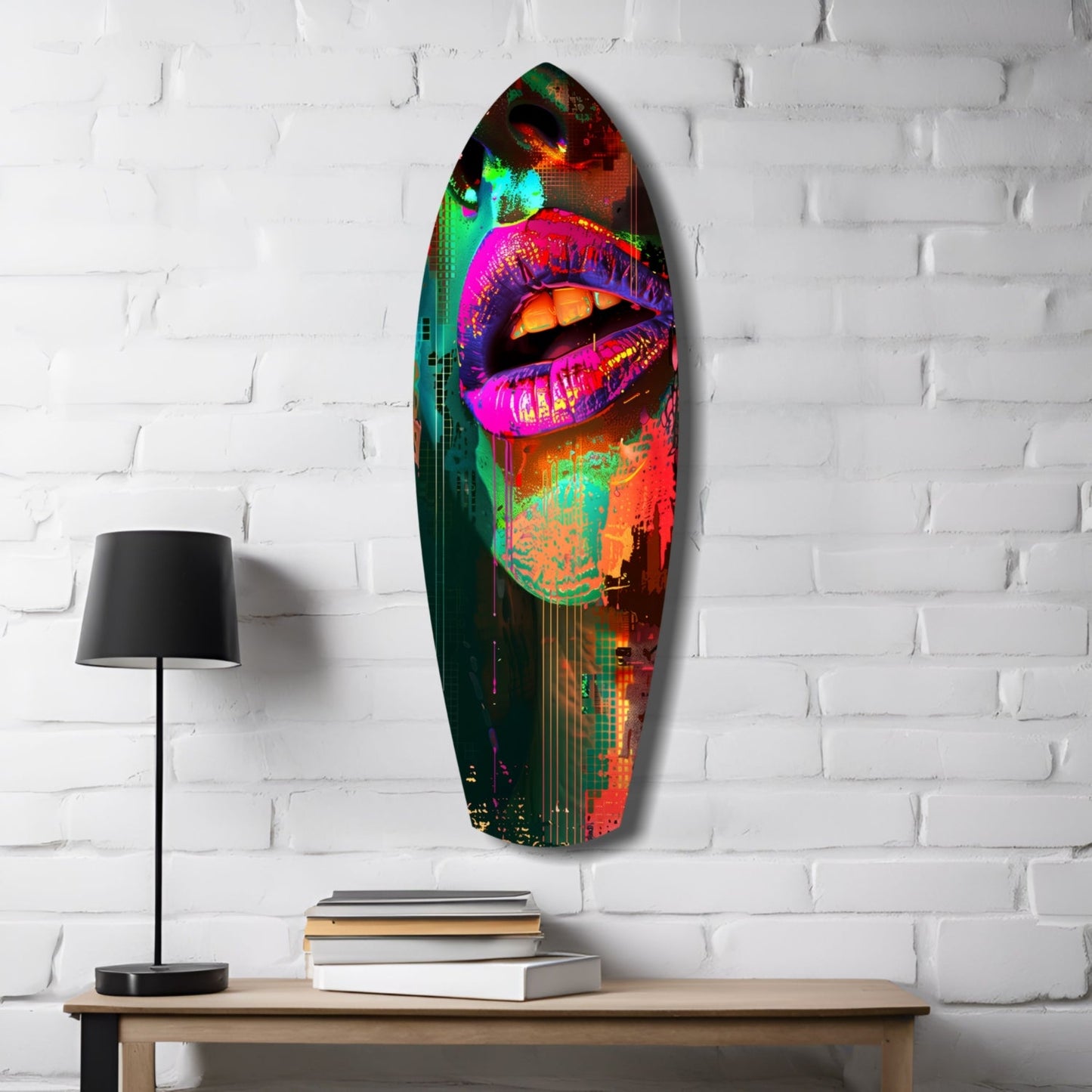 Vibrant neon pop art glass wall sculpture featuring colorful lips displayed on white brick wall above wooden table with lamp and books.