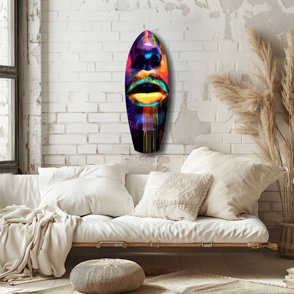 Neon-colored glass wall art featuring vibrant rainbow lips displayed above a cream-upholstered bed in a minimalist bedroom.