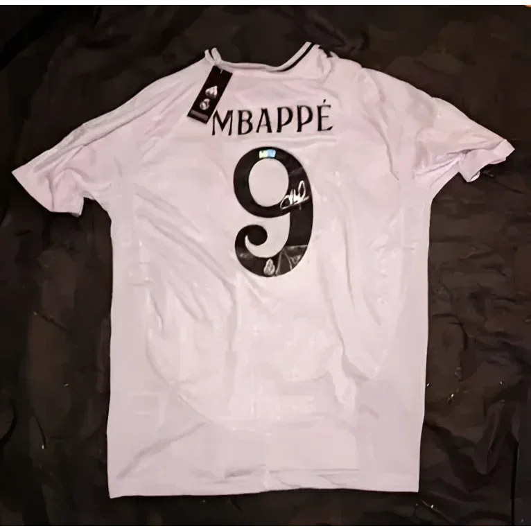 White Kylian Mbappe Real Madrid signed jersey with MBAPPE and number 9 on back