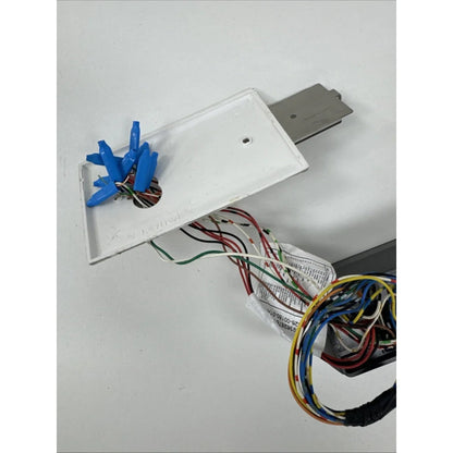 Back of L-1 Identity Solutions 4GFXLSP card reader with white outlet cover, blue connectors, exposed wiring