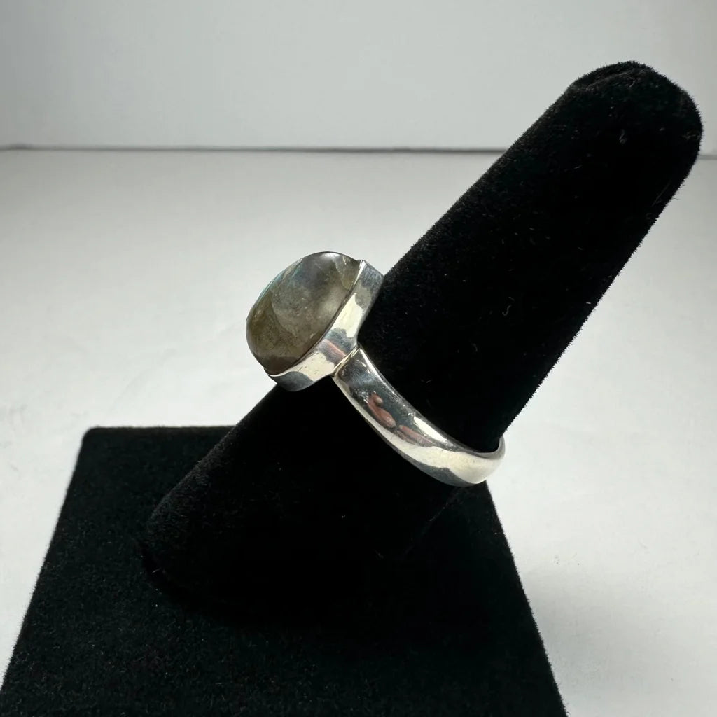 Elegant labradorite ring with oval silver stone in polished band