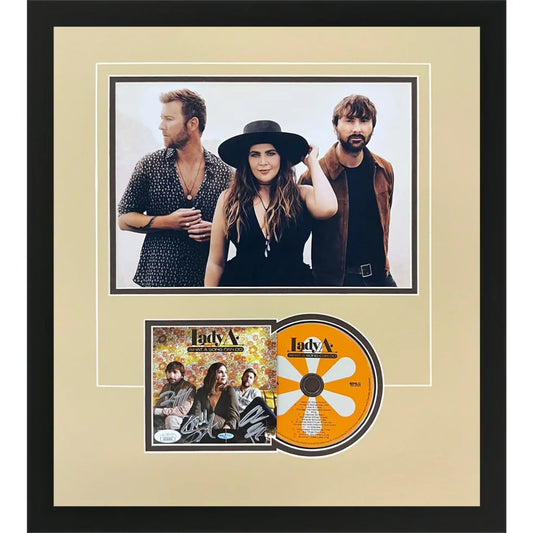 Framed signed Lady A What a Song Can Do deluxe CD and photo with black frame and beige matting, JSA authenticated