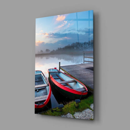 Vibrant red black rowboat on misty lakeside dock glass wall art print