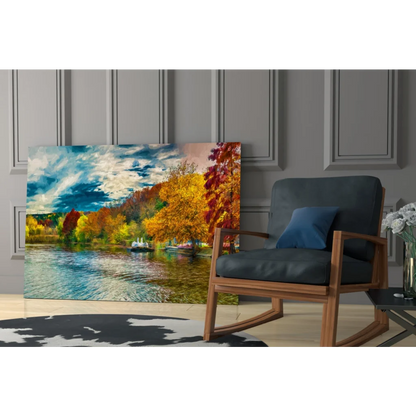 Vibrant autumn glass wall art of fiery trees reflected in calm blue lake