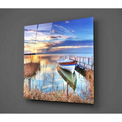 Stunning sunset boat glass wall art with serene lakeside scene