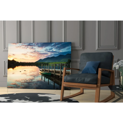 Serene sunset glass wall art of lake reflections, mountains, dock, and canoe
