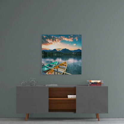 Serene sunset lake glass wall art with moored rowboats and mountains