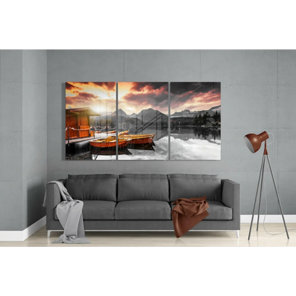 Stunning sunset boats triptych wall art with orange glow on glass wall
