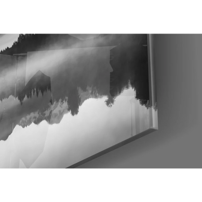 Abstract black-and-white glass wall art of misty mountains and silhouetted trees
