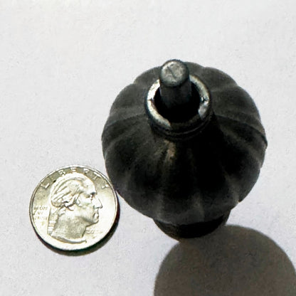 Looking straight down on the assembled miniature lamp: the fluted shade, its collar ring and the slotted top of the post, next to a US quarter