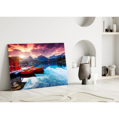 Vibrant sunset lake glass wall art with red boats and mountains