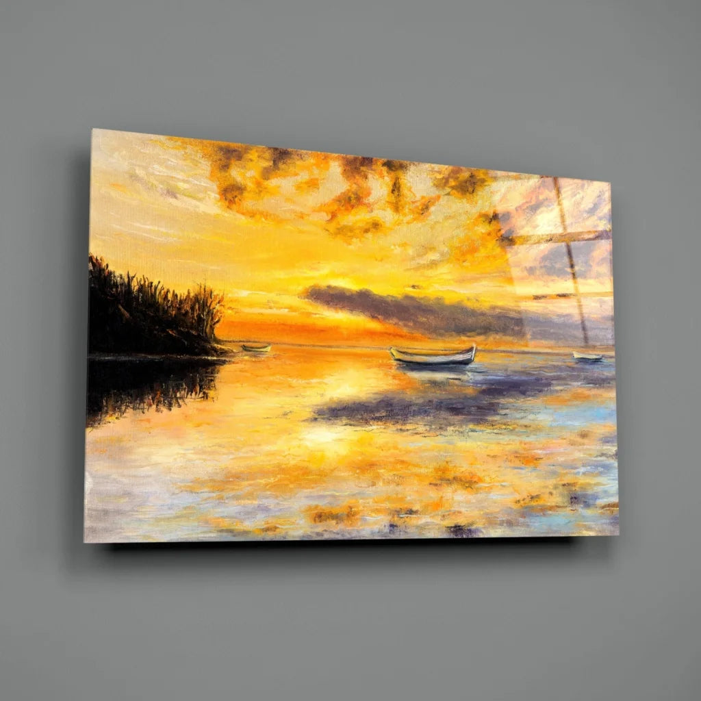 Serene sunset glass wall art with boats and golden skies on calm water