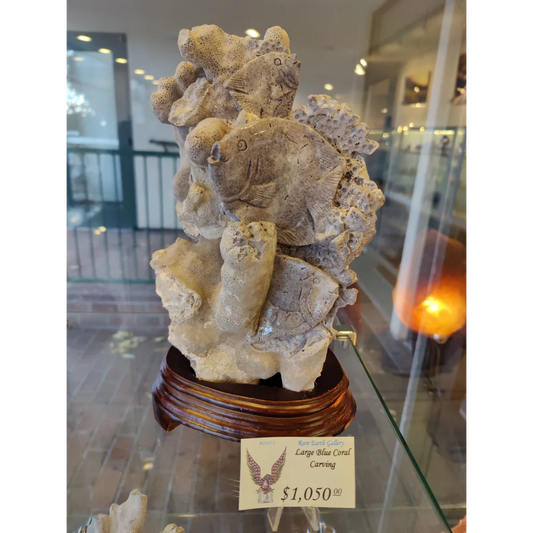 Large blue coral carving with detailed stone fish and coral textures