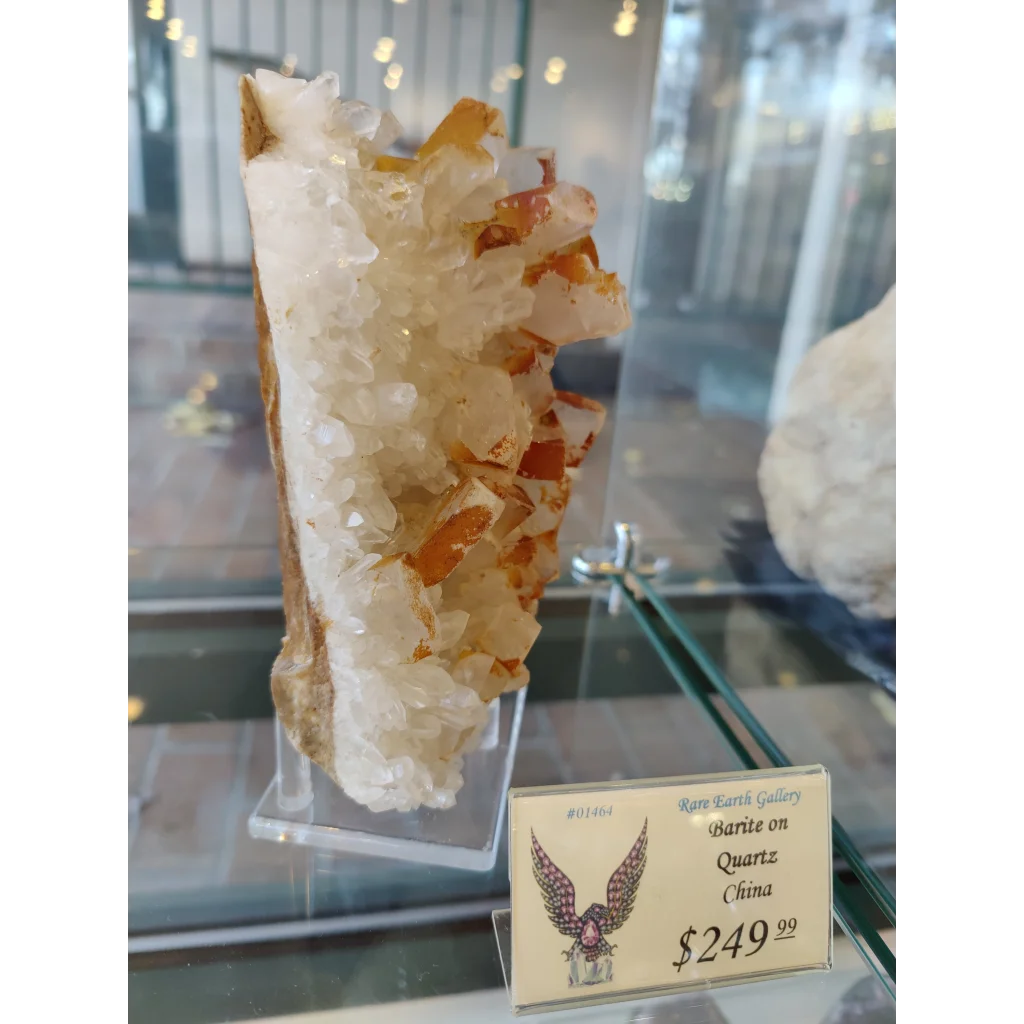 Large orange translucent barite on quartz specimen from China in acrylic stand